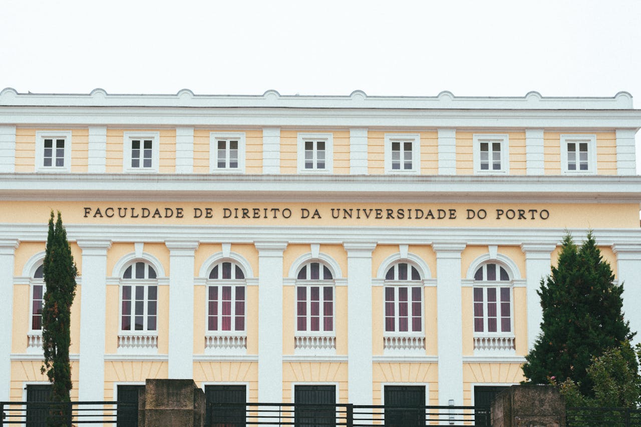 Facade of the Faculty of Law at the University of Porto, showcasing classic architecture.